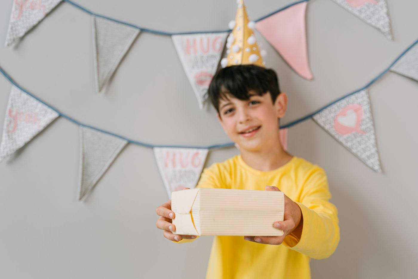 A happy child holding a wrapped gift